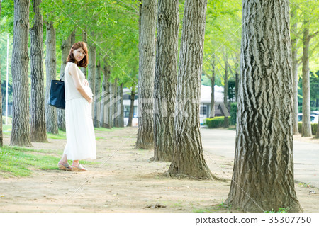 Park walk of late pregnancy woman Park walk of late pregnancy woman 35307750