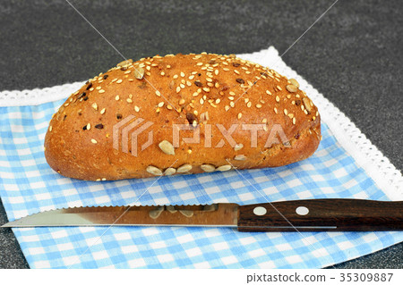 Fresh Tasty Bread on Dark Background Fresh Tasty Bread on Dark Background 35309887