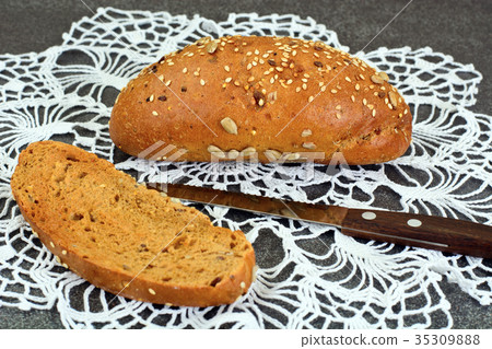 Fresh Tasty Bread on Dark Background Fresh Tasty Bread on Dark Background 35309888