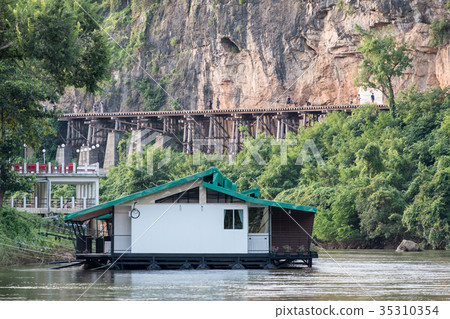 House floating on river kwai with ancient railway House floating on river kwai with ancient railway 35310354