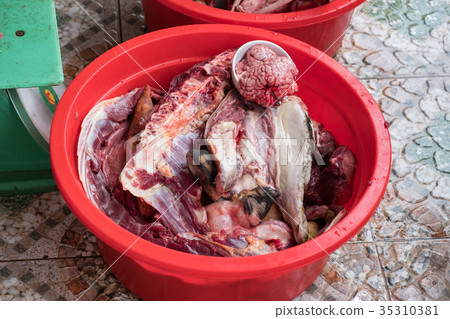 Dog meat sliced local food 35310381