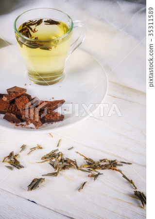 cup green tea and slices of chocolate 35311589