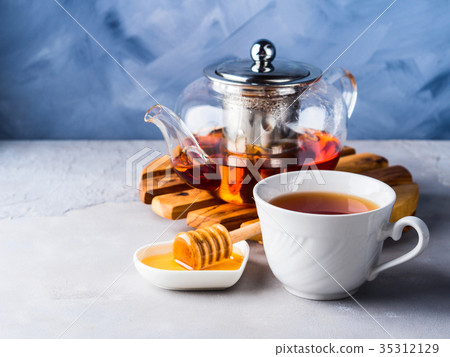 Teapot of red tea and honey Teapot of red tea and honey 35312129