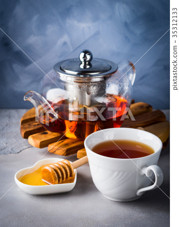 Teapot of red tea and honey Teapot of red tea and honey 35312133