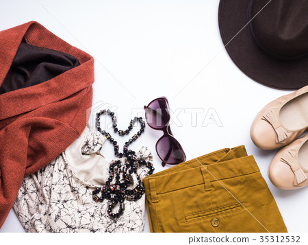 Flat lay with woman's autumn clothes, glasses hat 35312532