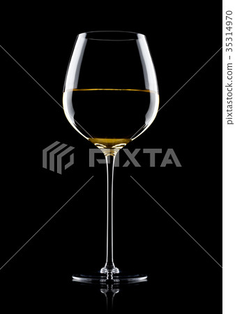 Glass of white wine with reflection on black 35314970