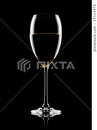 Glass of white wine with reflection on black 35314979