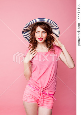 the girl in the hat on a pink background pinup the girl in the hat on a pink background pinup 35315190