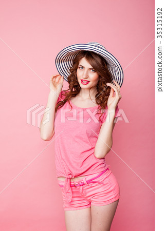 the girl in the hat on a pink background pinup the girl in the hat on a pink background pinup 35315192