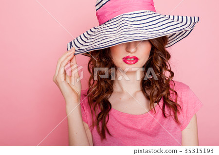 the girl in the hat on a pink background pinup the girl in the hat on a pink background pinup 35315193