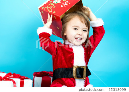 Happy toddler girl with Christmas gift boxes Happy toddler girl with Christmas gift boxes 35318099