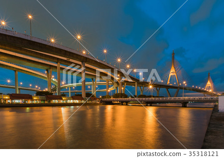 Twin twilight suspension bridge river front Twin twilight suspension bridge river front 35318121