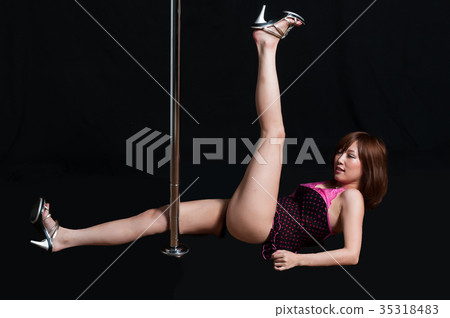 Japanese woman lying on pole dance in black back 35318483