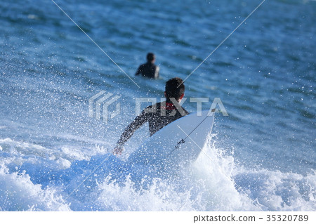 A surfer waiting for a wave A surfer waiting for a wave 35320789