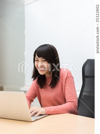 A woman heading to a computer A woman heading to a computer 35322602