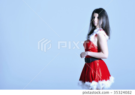 Beautiful sexy young woman in Santa costume Beautiful sexy young woman in Santa costume 35324082