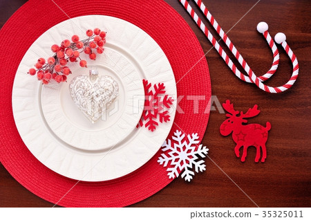Serving with christmas decorations on plate 35325011