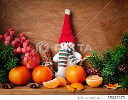 Snowman with tangerines and branches of fir 35325073