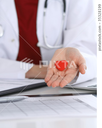 Unknown female doctor with stethoscope holding Unknown female doctor with stethoscope holding 35328199