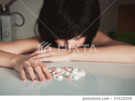 Woman with drugs. Addiction concept Woman with drugs. Addiction concept 35328209