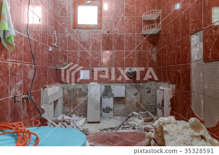 Damaged interior of old bathroom with red tiles Damaged interior of old bathroom with red tiles 35328591