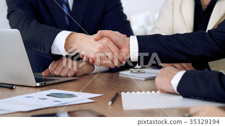 Close up of business people shaking hands at Close up of business people shaking hands at 35329194