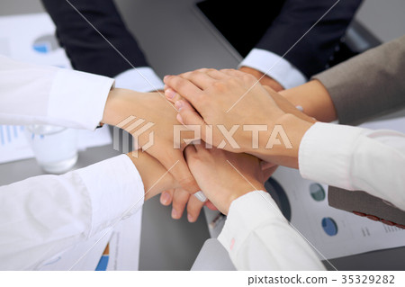 Business people group joining hands 35329282