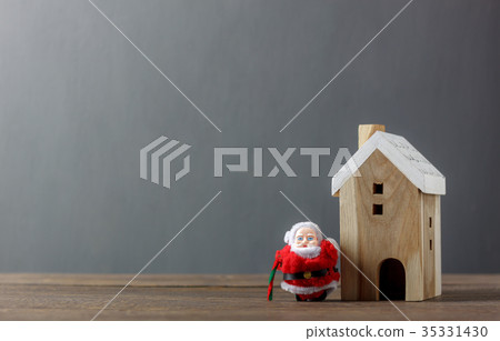 Santa Claus and white wooden home Santa Claus and white wooden home 35331430