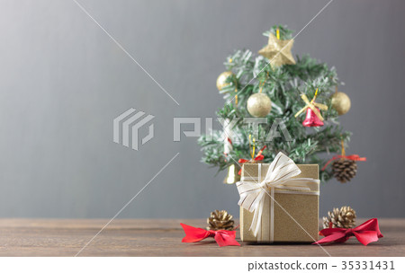 Gold gift box and Fir tree  sign accessory season. 35331431