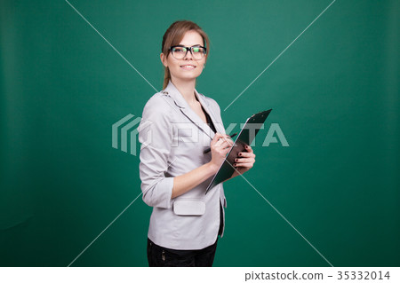 business woman secretary stands with folder 35332014