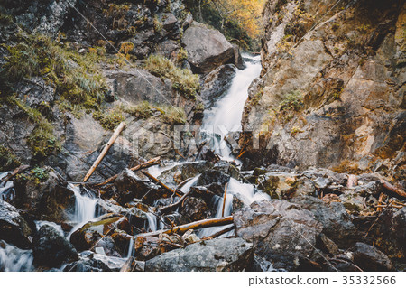 Waterfall and mountain river in mountains 35332566