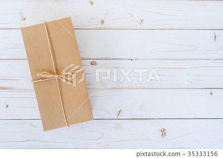 Top view above brown gift box on wooden 35333156