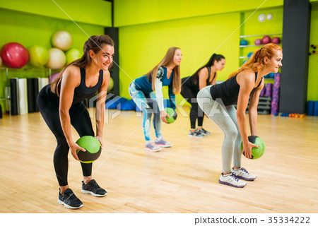 Women group with balls, fitness workout 35334222
