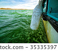 View of Green Ocean Waves from Boat Board 35335397