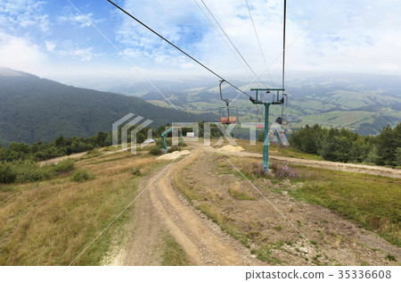 The mountain lift carries tourists and luggage The mountain lift carries tourists and luggage 35336608