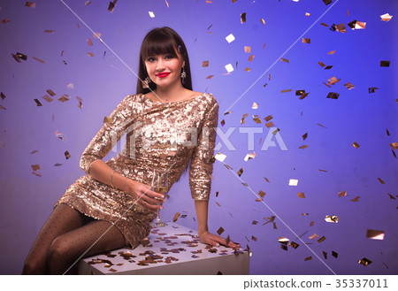 woman with glass of champagne at celebration party woman with glass of champagne at celebration party 35337011