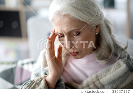 Mature woman suffering from headache 35337157