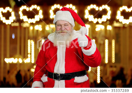 Santa Claus giving thumb up. 35337289