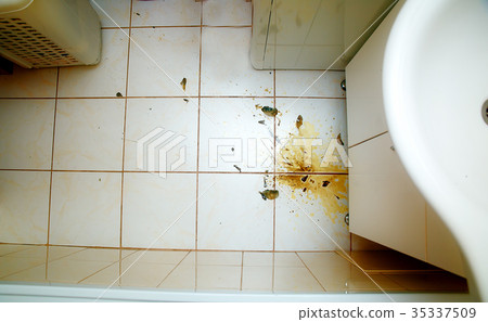 Colorful stains and broken glass on white bathroom 35337509