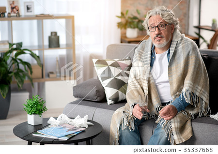 Upset mature male having flue 35337668