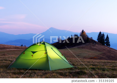 Green tent lighted from the inside Green tent lighted from the inside 35339105