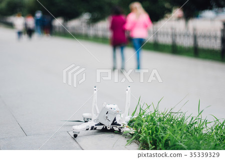 Crashed drone on the ground Crashed drone on the ground 35339329
