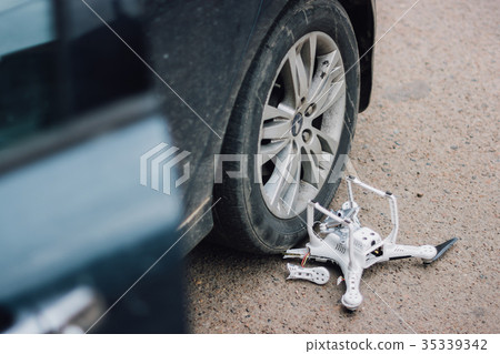 Crashed drone on the ground Crashed drone on the ground 35339342