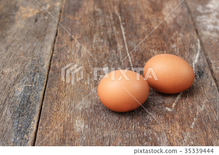 egg on wood background egg on wood background 35339444