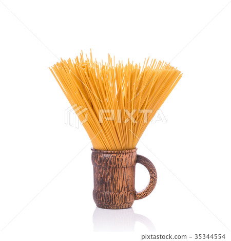 Yellow long spaghetti, Raw spaghetti. Studio shot isolated on white Yellow long spaghetti, Raw spaghetti. Studio shot isolated on white 35344554
