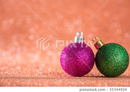Christmas and New Year Background. Shiny Christmas Ball on Red Holiday and New Year Abstract Blurred Defocused Background 35344934