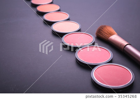 Set of decorative cosmetics and soft brush on stone Set of decorative cosmetics and soft brush on stone 35345268