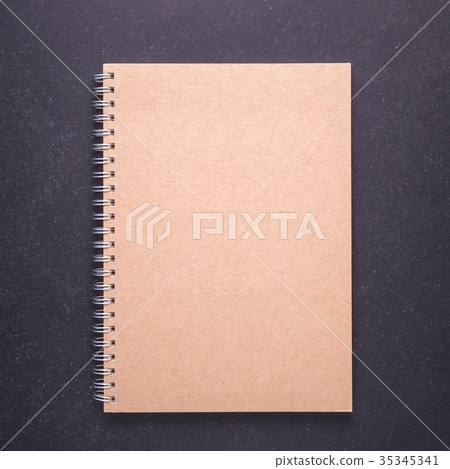 Notebook with blank empty cover on black stone table background. Top view Notebook with blank empty cover on black stone table background. Top view 35345341