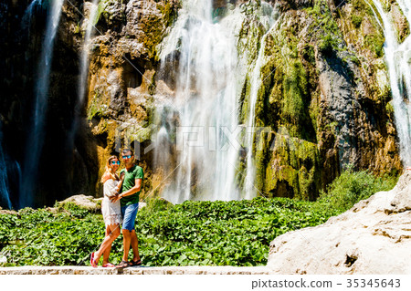 Couple near the Waterfall in Croatia Couple near the Waterfall in Croatia 35345643
