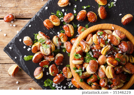fried broad beans with salt and herbs in a bowl 35346229
